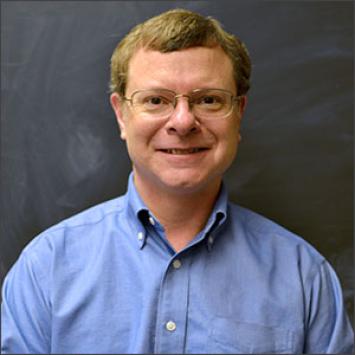 a profile photograph of Mark Swanson