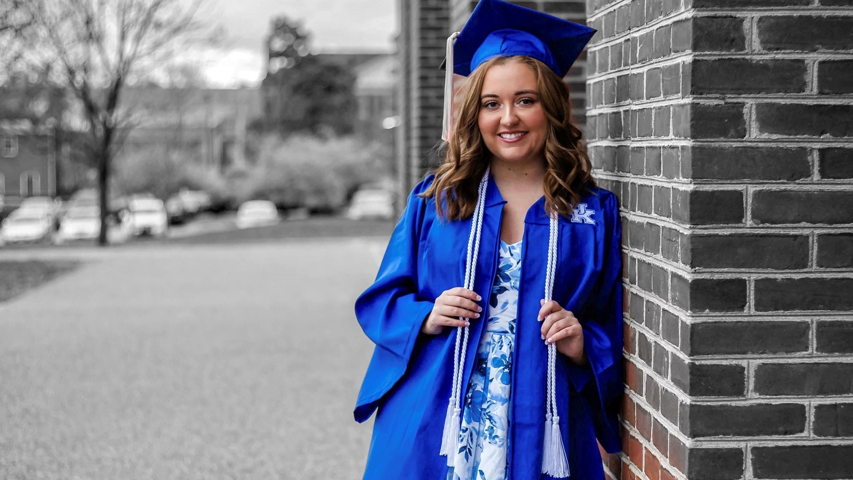 a photograph of Ashley Duff in their graduation robes