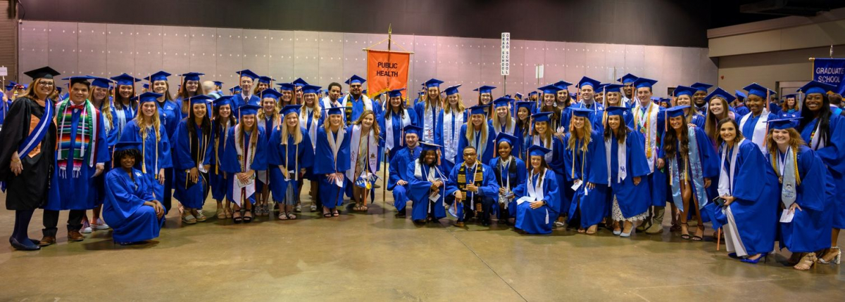 a group photograph of a graduating class of public health students