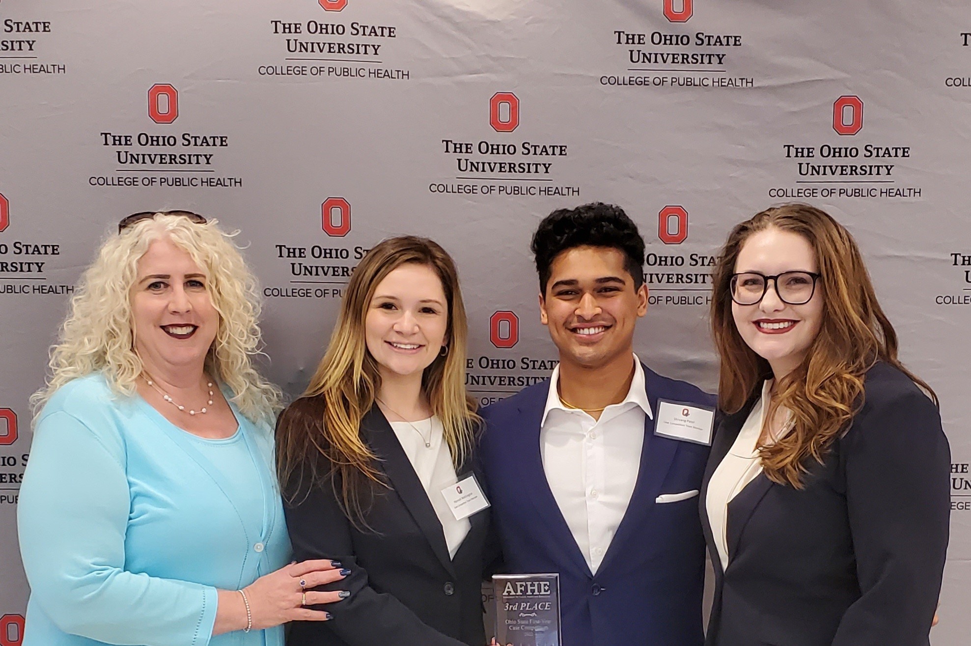 a photograph of Maureen Jones, Hannah Wethington, Shivang Patel, and Shelby Watkins