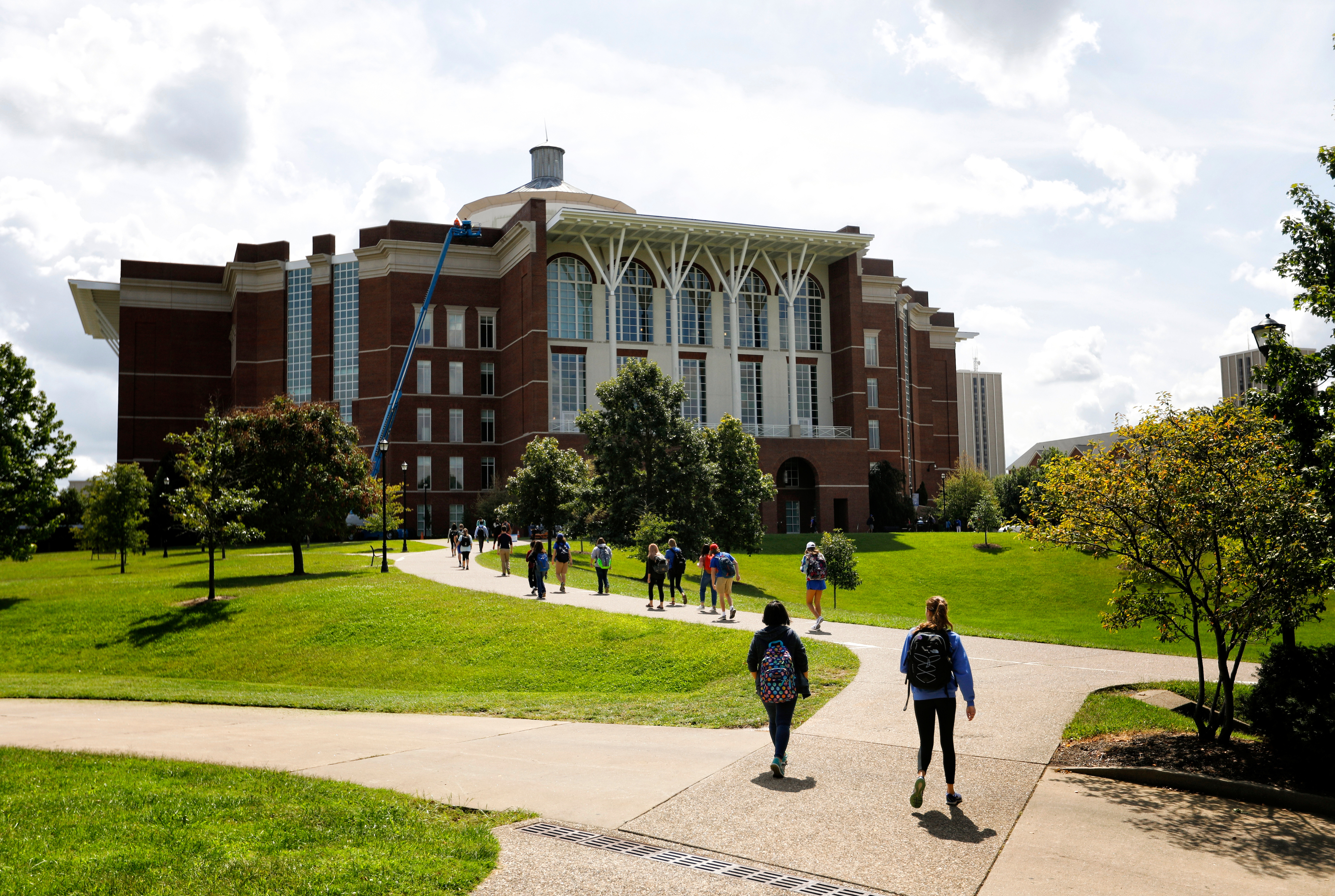 a photograph of students walking to the William T. Young Library on the University of Kentucky's campus