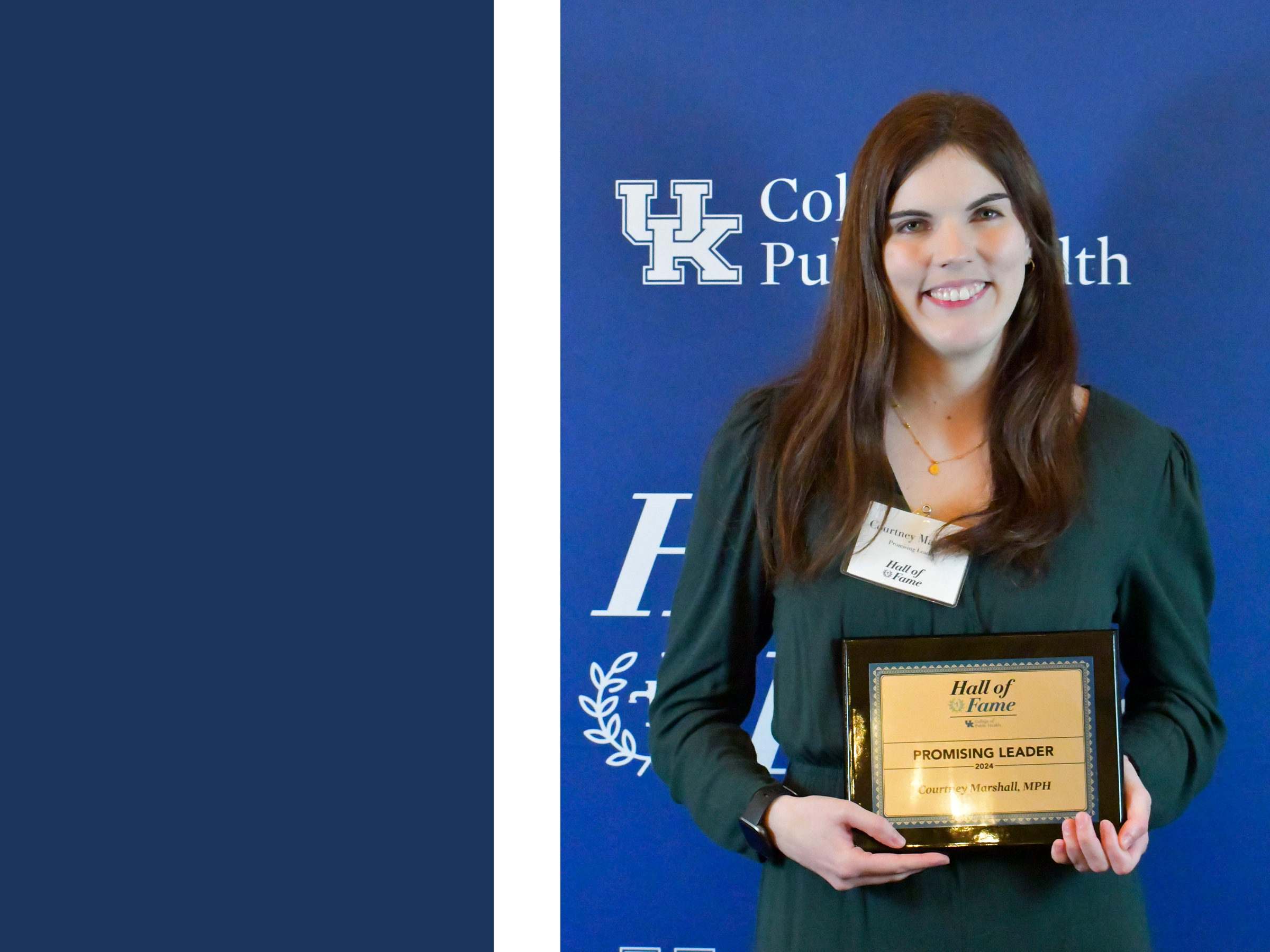 a photograph of Courtney Marshall holding their award