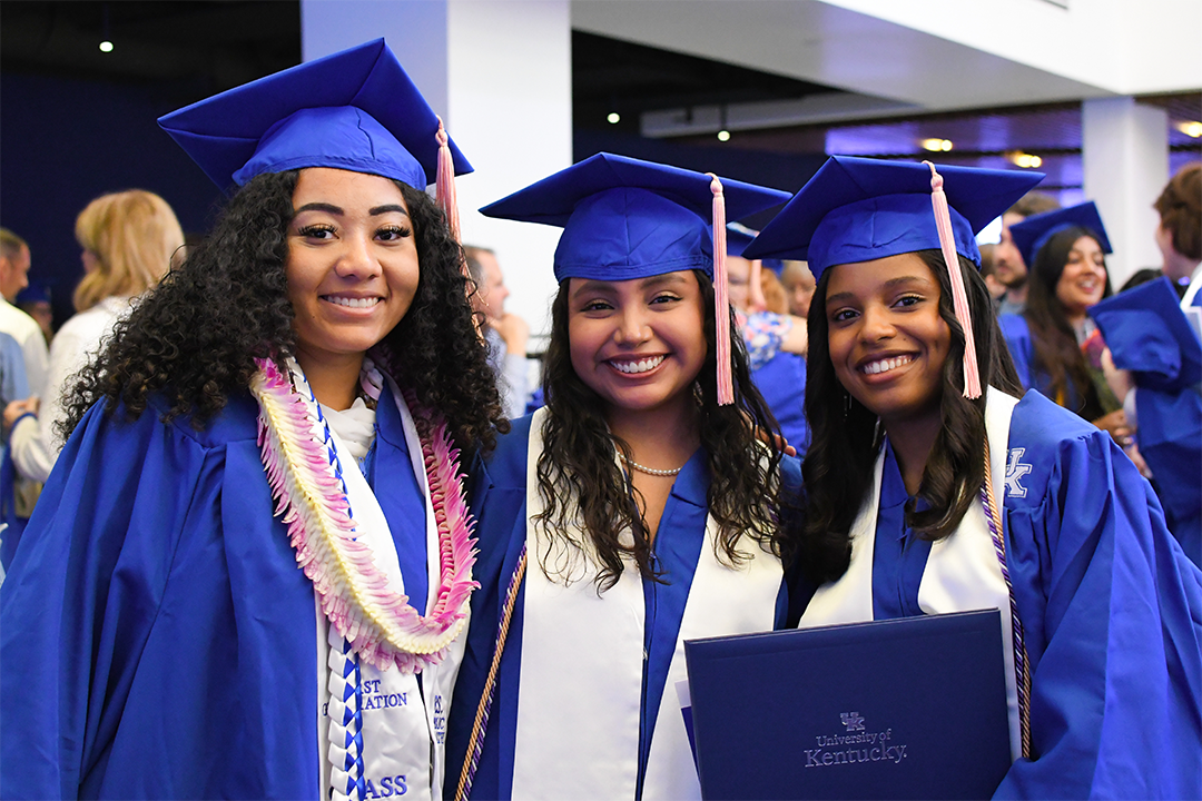 a photograph of CPH students outside of their graduation ceremony posing for the camera