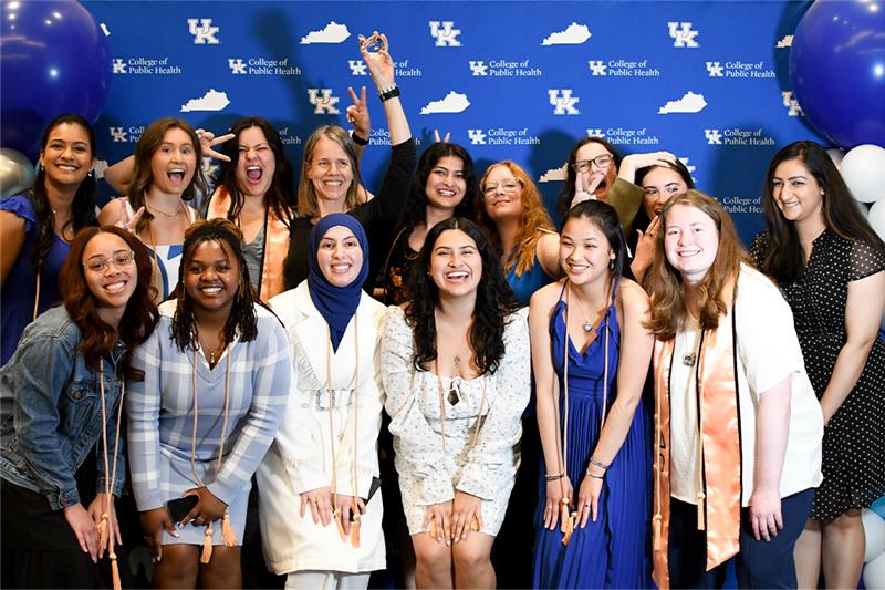 a photograph of a group of college of public health graduates at an event