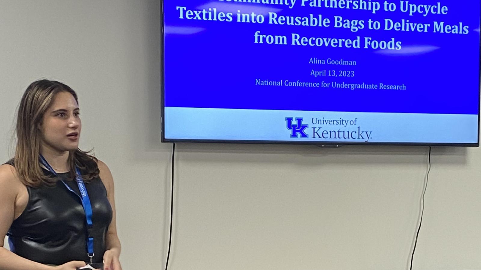 Picture of Alina Goodman presenting at a conference