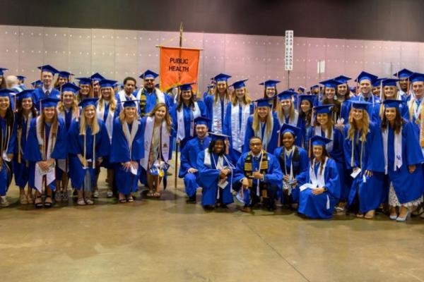 a group photograph of a graduating class of public health students