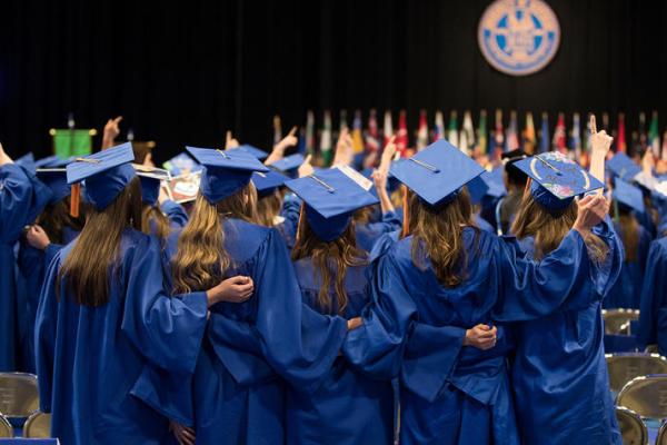 a photograph of graduate University of Kentucky students in their gowns