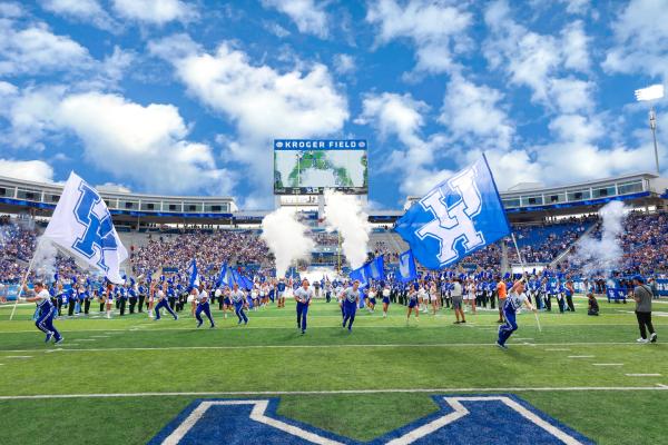 a photograph on the field at Kroger Field where the University of Kentucky's cheerleaders are starting to perform