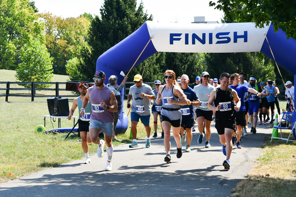 a photograph of a large group a runners at the start of a race