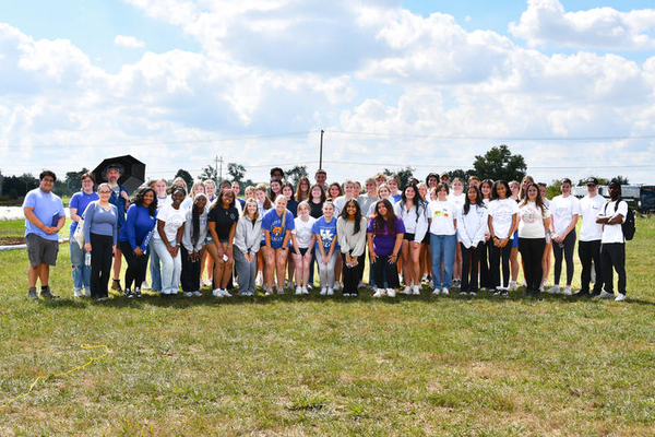 students posing at the event in a group photo