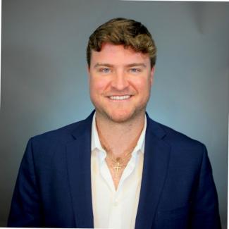 a profile photograph of Colby Hall