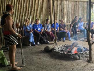 students and faculty watch a Ecuadorian cultural presentation