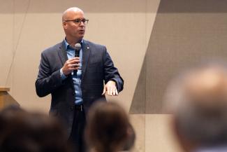 a photograph of Dr. Steven Stack presenting at the Pump It Up event