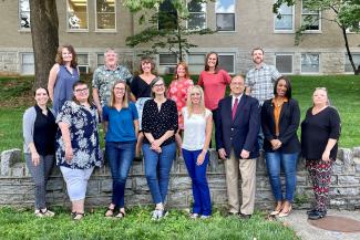 a group photograph of the College of Public Health's Epidemiology and Environmental Health department.