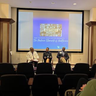 panelist talk in front of an audience at the Melanin Elements of Healthcare event