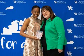 Kangai Miriti pictured with Dean Heather Bush receiving Howard L. Bost Award