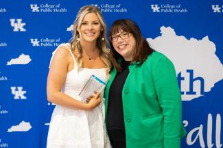 Pictured is Katie Boroughs with Dean Heather Bush receiving the Undergraduate Research Award