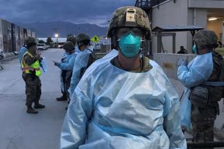 Maj. Hincks pictured outside with mask and protective gear