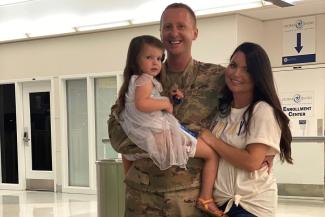 Maj. Marcus Hincks pictured with wife and daughter