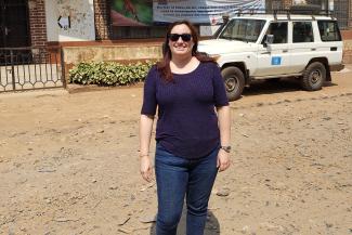 Charlene Siza standing in front of the provincial health division office in Bukavu Democratic Republic of the Congo during 2018 Ebola response