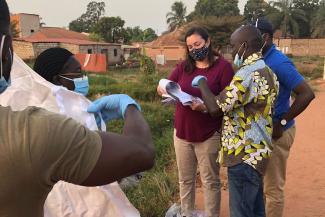 Charlene Siza providing instruction to polio environmental surveillance tea in Guinea-Bissau