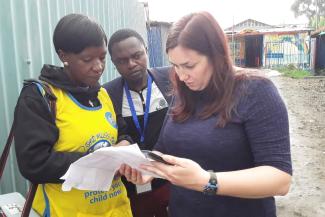 Charlene Siza providing supervision to the polio vaccination team during a vaccine campaign in Nairobi Kenya