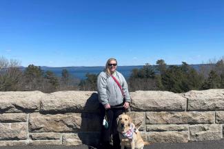 Sydney Clark and guide dog Jano at Acadia National Park in Maine