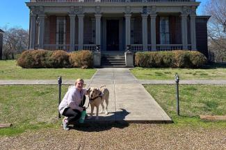 Sydney Clark and her guide dog Jano pictured outside Two Rivers Historical Mansion in Nashville Tennessee