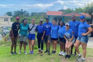 Group picture of public health students with Dr. Ketrell McWhorter in Puerto Rico, part of disaster relief trip in July 2023