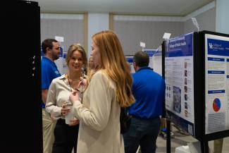a candid photograph of a research poster session