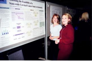 a photograph of Alisa Bowersock and Jennifer Redmond Knight by a research poster