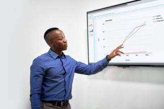 a stock photograph of someone pointing to a chart