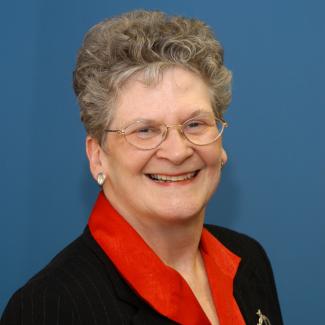a profile photograph of Sheila Schuster