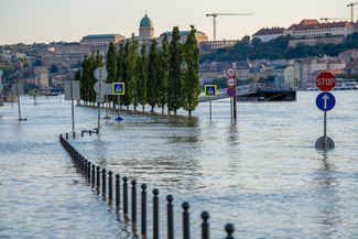 a stock photograph of a city being flooded with road signs sticking out of the water