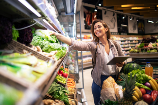 a stock photograph of a woman grocery shopping