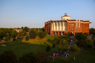 a photograph of the University of Kentucky's W. T. Young building at sunset