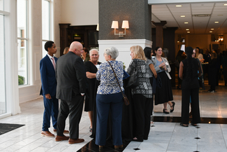 a photograph of event atendees socializing