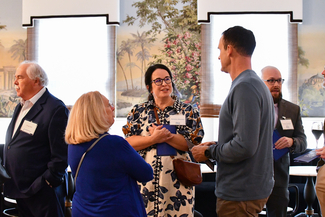 a photograph of atendees socializing