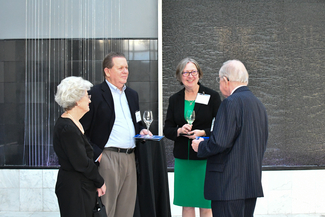 a photograph of atendees socializing