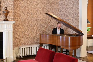 a photograph of the pianist at the event