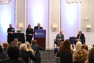 a photograph of someone speaking at the event