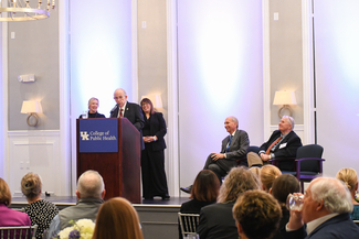 a photograph of someone speaking at the event