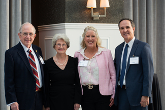 a photograph of attendees posing for the camera