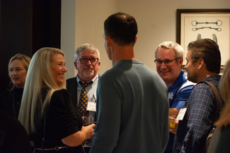 a photograph of attendees socializing