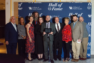 a photograph of attendees posing for the camera