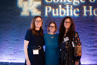 a photograph of attendees posing for the camera