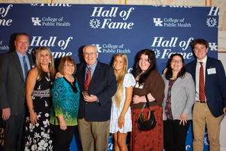 a photograph of attendees posing for the camera