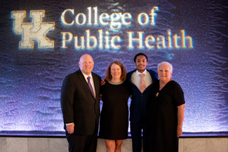 a photograph of attendees posing for the camera