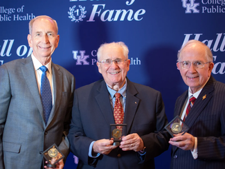 Dr. Steve Davis, Dr. William Hacker, and Mark Birdwhistell holding their Hume Medallions at the Hall of Fame 2025 awards