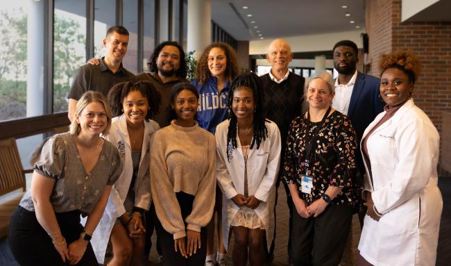 a photograph of a group of students and faculty at the African American Research Training Scholars reception